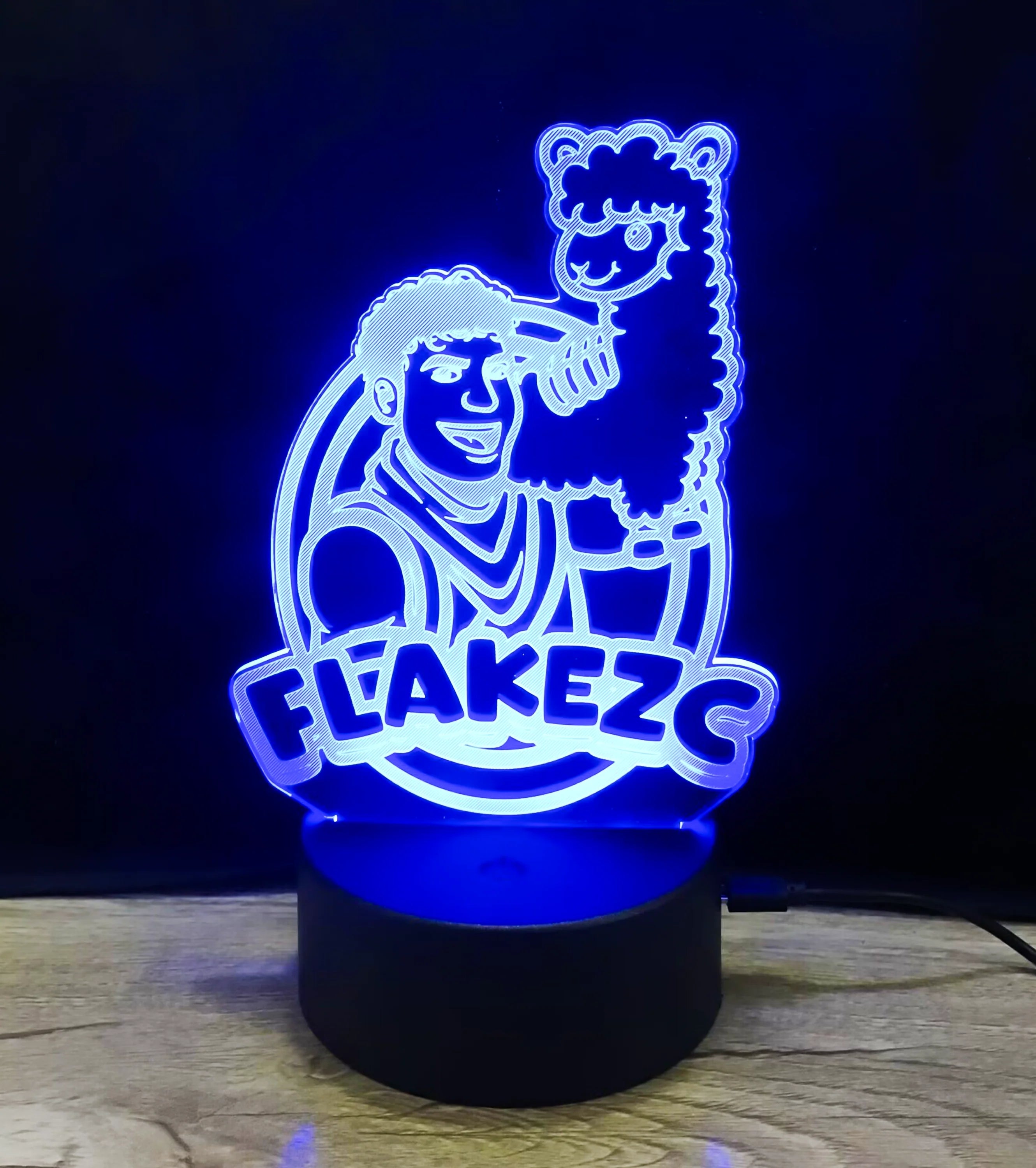 Flakezc 3D-LED-Lampe mit kräftigem blauen Lichteffekt und Logo-Design – stimmungsvolles Deko-Highlight für die Community.